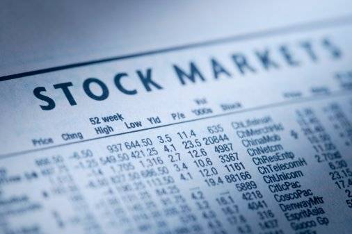 Stockmarket data in newspaper, close-up (blue toned)