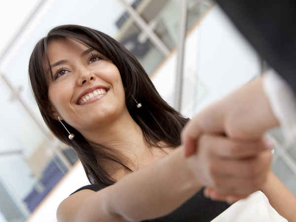 Business woman handshaking with an other person