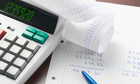 A calculator and sums on paper
